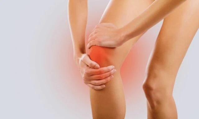 Person holding knee in pain